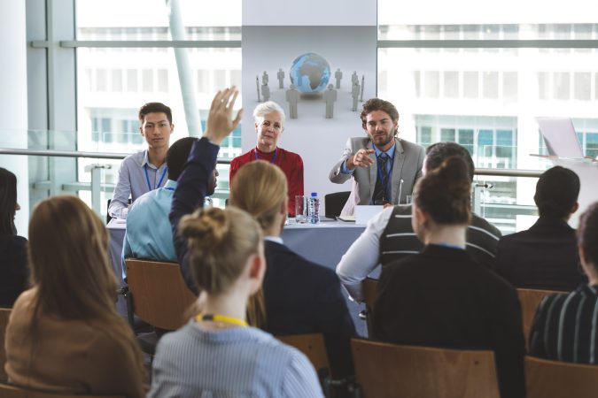 businessman-raising-handat-business-seminar-in-off-2023-11-27-05-20-19-utc