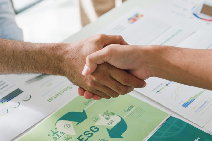 closeup-asia-businesspeople-shaking-hands-over-esg-2024-11-02-10-44-52-utc