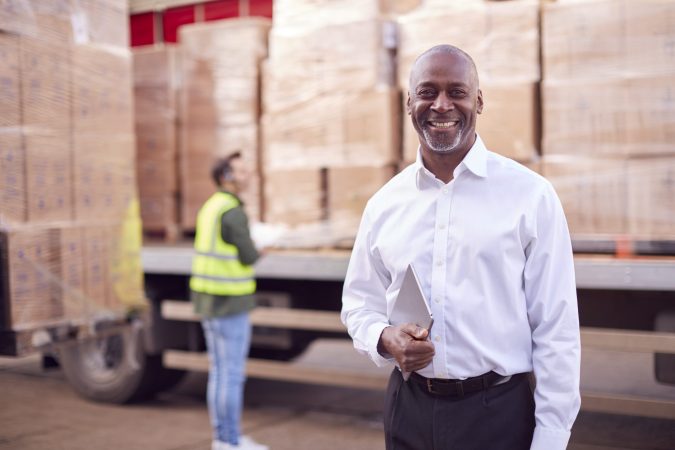 portrait-of-male-freight-haulage-manager-standing-2024-10-19-02-30-56-utc